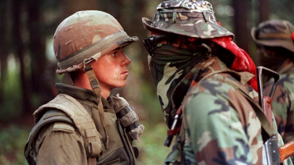 Canadian soldier Patrick Cloutier and protester Brad Laroque come face-to-face during a standoff at the Kanesatake reserve in Oka, Quebec on September 1, 1990.