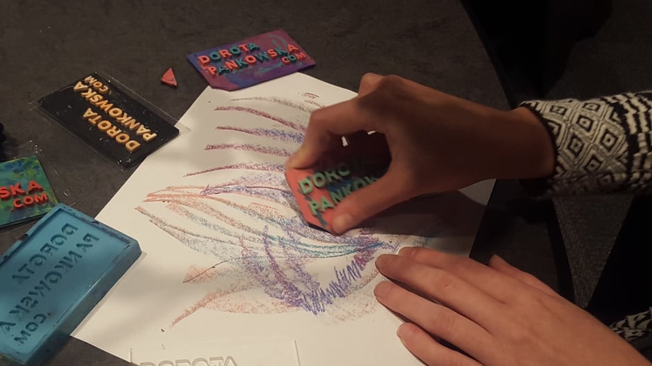 Dorota Pankowska colours with one of her crayon business cards.