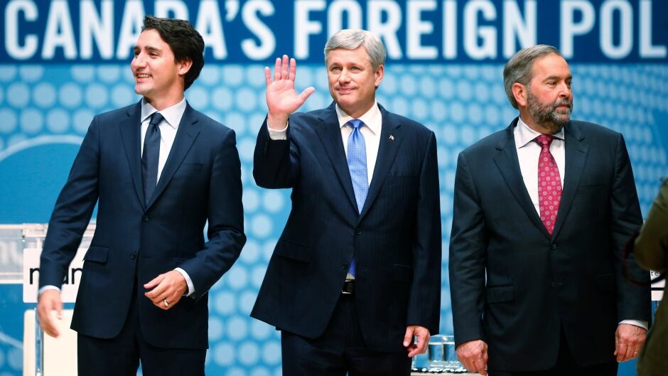 Liberal leader Justin Trudeau, Conservative leader and Prime Minister Stephen Harper and New Democratic Party (NDP) leader Thomas Mulcair (L-R) talk before the Munk leaders' debate on Canada's foreign policy in Toronto.