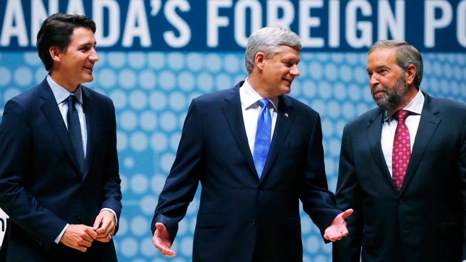 Liberal Leader Justin Trudeau, left, Conservative Leader Stephen Harper, centre, and New Democratic Party Leader Tom Mulcair, right, chat on stage at the Munk Debate on Canada's foreign policy in Toronto, on Tuesday, September 28, 2015.
