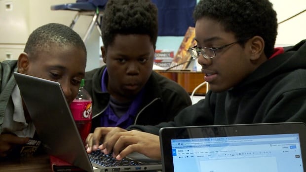 Students and laptops