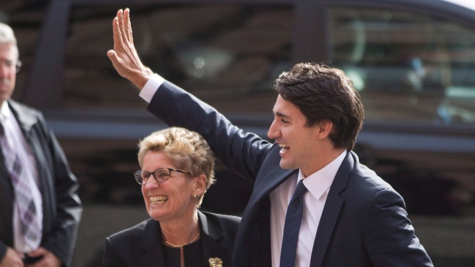 Canadian prime minister-designate Justin Trudeau is greeted by Ontario Premier Kathleen Wynne at the Queens Park Legislature in Toronto on Tuesday.