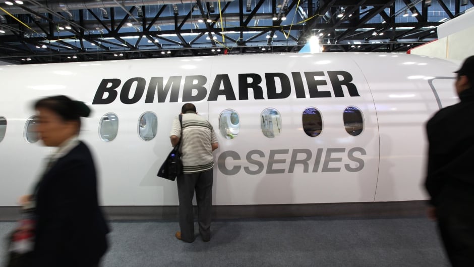 epa02927599 Visitors pass by a section of a Bombardier plane on display during the Aviation Expo China 2011 at the National Convention center in Beijing, China on 21 September 2011. China is expected to become the second largest aviation market after the United States by 2030 with Chinese aircraft manufacturers joining the top four, said Airbus Chief Operating Officer Customers John Leahy, state media Xinhua reported on 20 September. EPA/HOW HWEE YOUNG