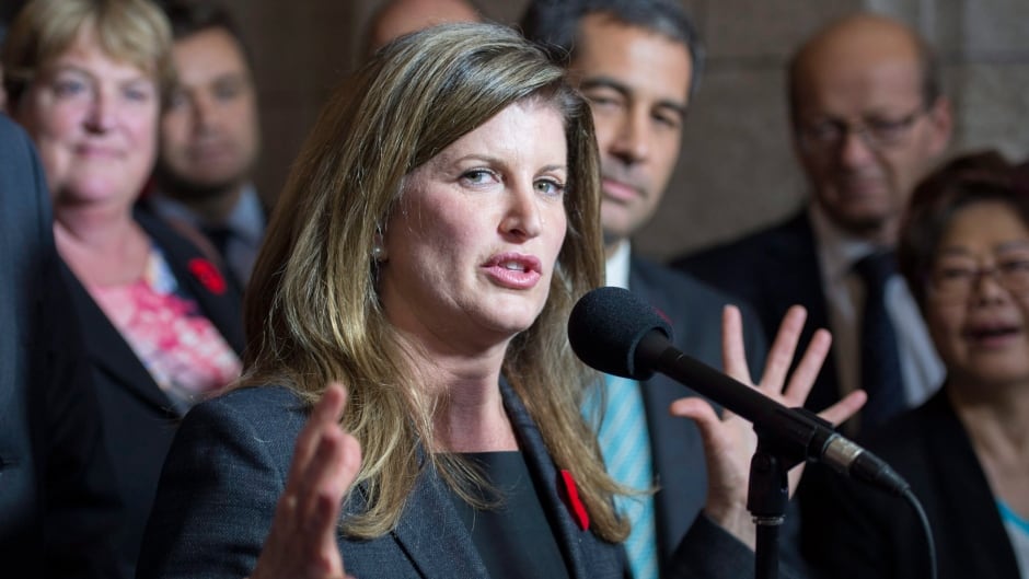 Rona Ambrose smiles as she is introduced as the interim-leader of the Conservative party following a caucus meeting Thursday November 5, 2015 in Ottawa.