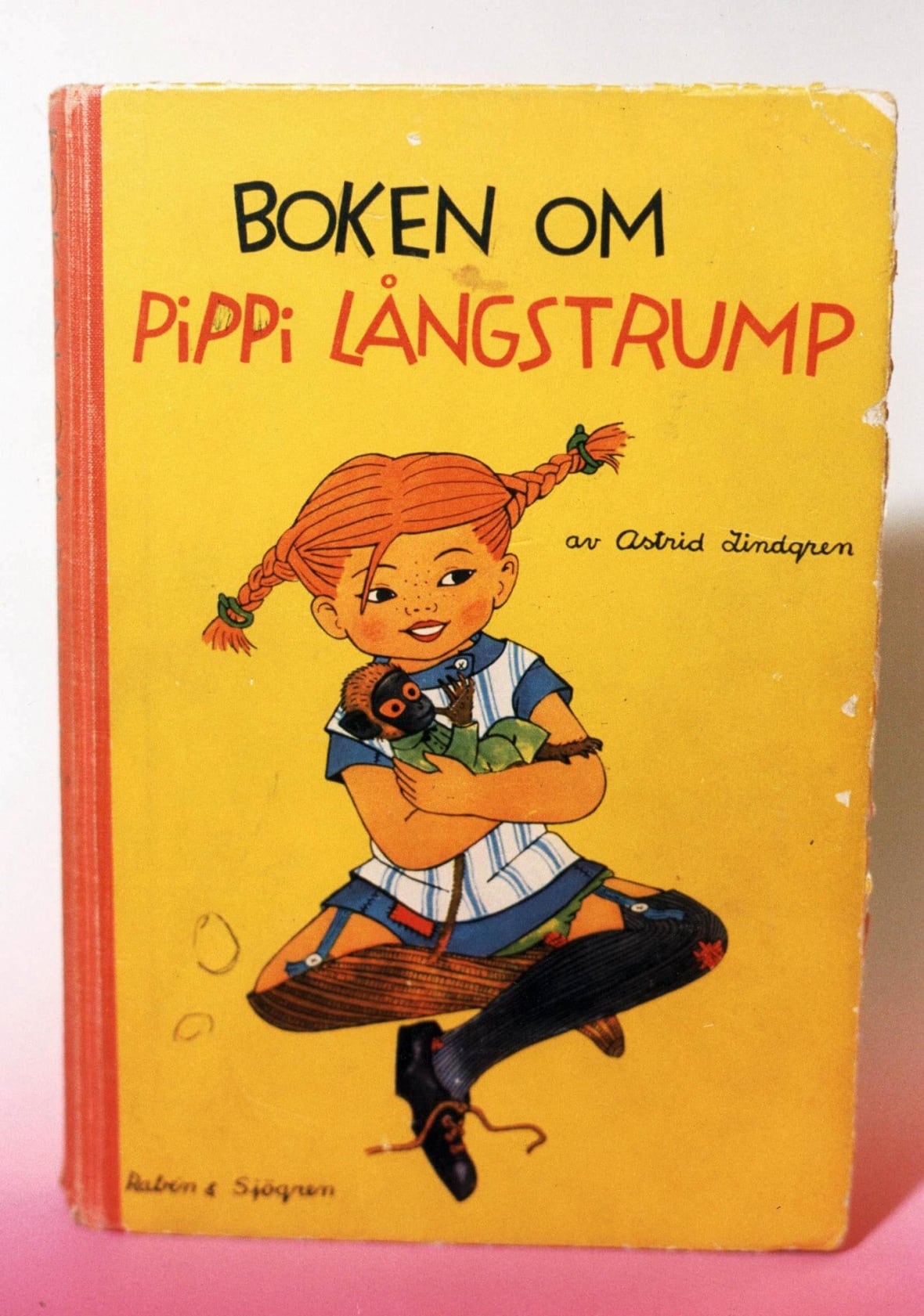 Book for children with a yellow cover and clarification of a small red hair in the processed connection wires.