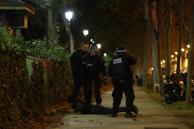 Paris ATTACKS officers detain person outside Bataclan Nov 13 2015