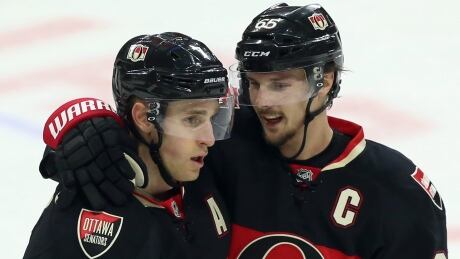 Kyle Turris, left, who scored into an empty net, and Ottawa captain Erik Karlsson, who had two goals earlier, led the Senators to a 3-0 victory over the Columbus Blue Jackets in Ottawa. Turris-Karlsson