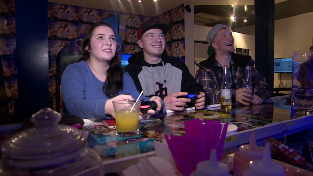 Patrons at the Bartari video game bar in Saskatoon