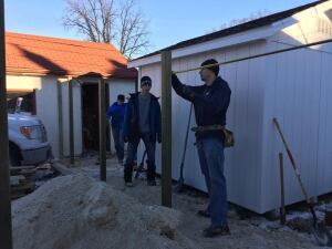 Workers building fence