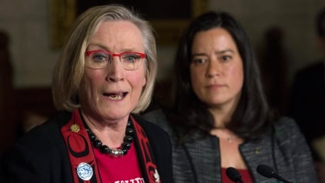 Minister of Justice and Attorney General of Canada Jody Wilson-Raybould looks on as Minister of Indigenous and Northern Affairs Carolyn Bennett responds to a question during an announcement for a missing and murdered indigenous women inquiry during a news conference in the Foyer of the House of Commons Tuesday December 8, 2015 on Parliament Hill in Ottawa. Indigenous 20151208