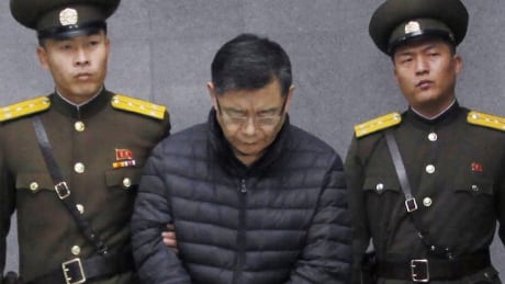 Hyeon Soo Lim, centre, who pastors the Light Korean Presbyterian Church in Toronto, is escorted to his sentencing in Pyongyang, North Korea, Wednesday, Dec. 16, 2015. North Korea's Supreme Court sentenced a Canadian pastor to life in prison with hard labor on Wednesday for what it called crimes against the state. North Korea Detained Canadian