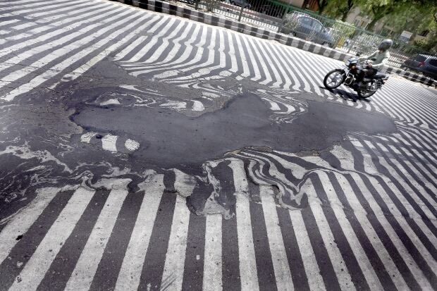 India heatwave distorts road markings
