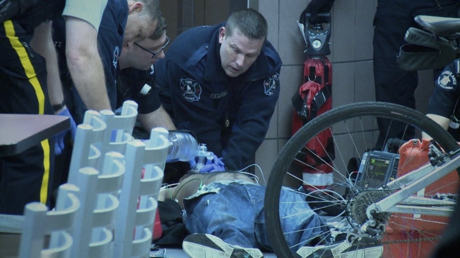 First responders in Surrey, B.C., work to revive a man who has suffered an overdose and collapsed on the floor of a McDonald's in October, 2015.