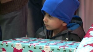 Syrian child receives gift at event
