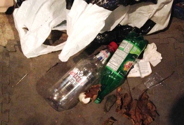 Empty vodka bottle at Kane house