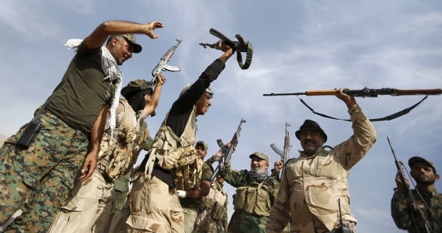 MIDEAST-CRISIS IRAQ forces backed by militia retake former Saddam fort from ISIS Oct 2015