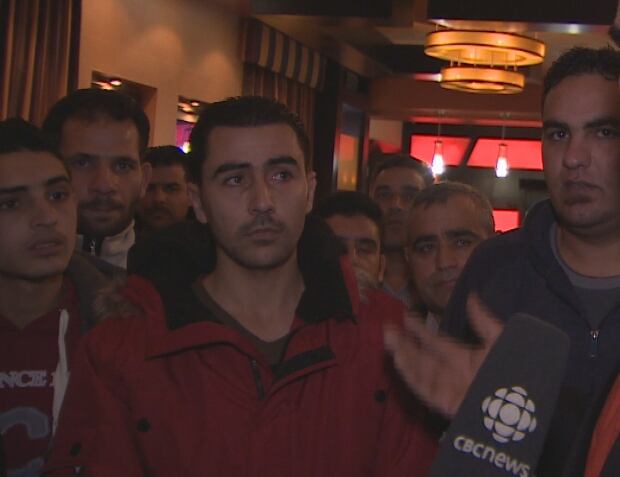 Tarek Ramadan helps translate for Syrian refugees