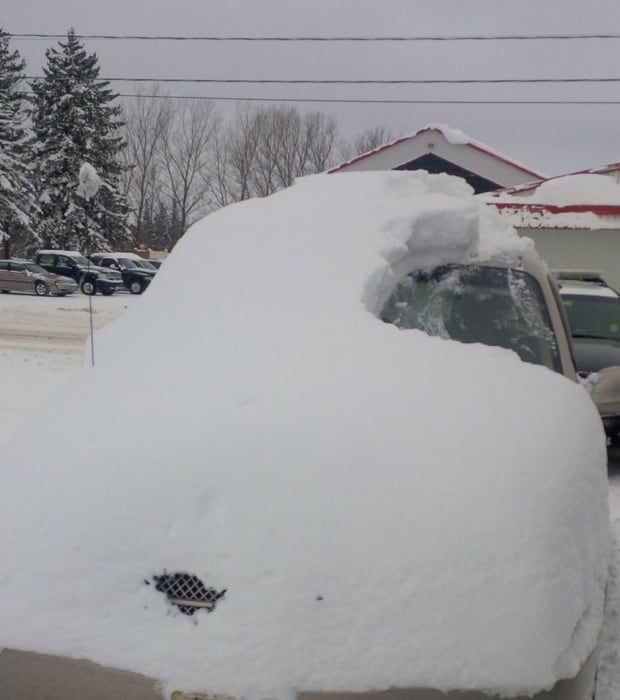 Snow-covered vehicle
