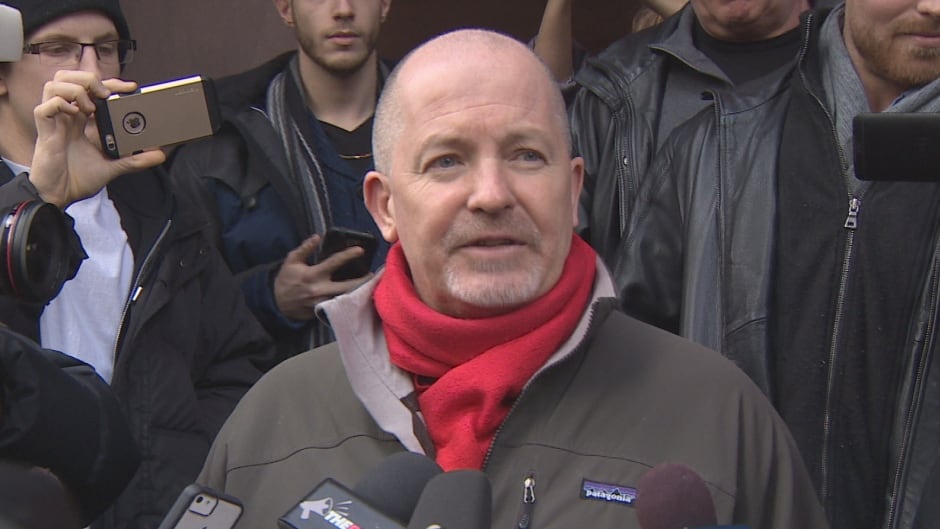 Gregory Alan Elliot speaks to reporters outside Old City Hall in Toronto after being found not guilty of harassing two women online, on Jan. 22, 2016.