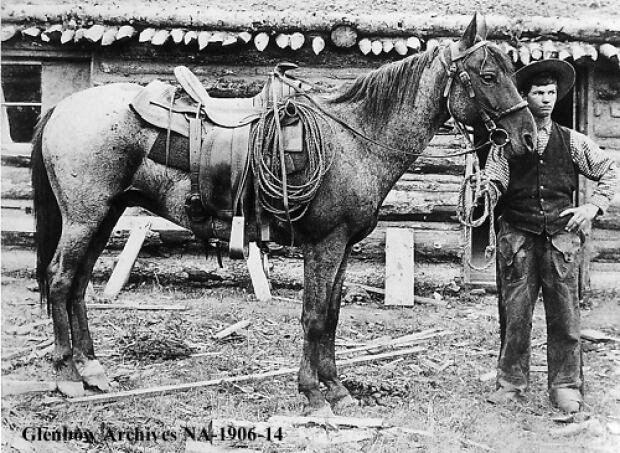 Cowboy with his horse, 1890