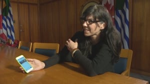 Andrea Reimer shows off the 311 app