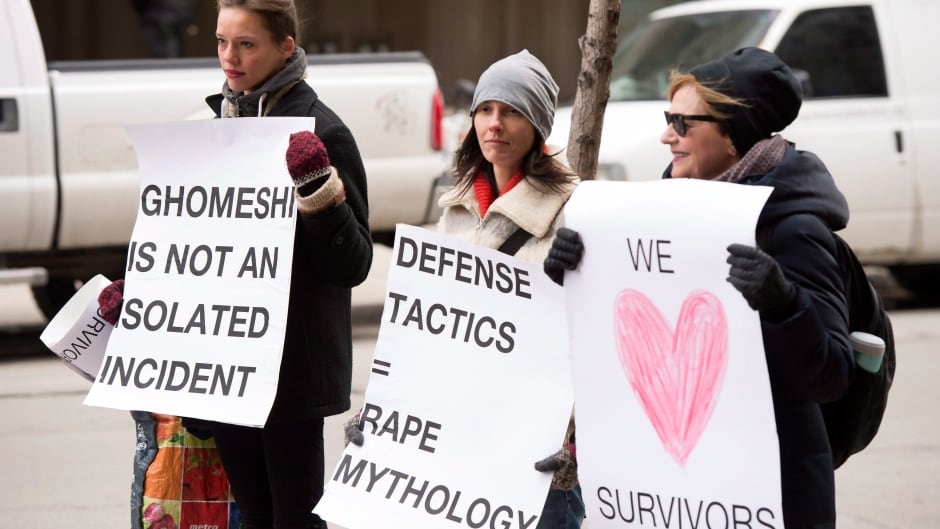 Protesters wait for Jian Ghomeshi to arrive for the third day of his trial on Thursday, Feb. 4, 2016.