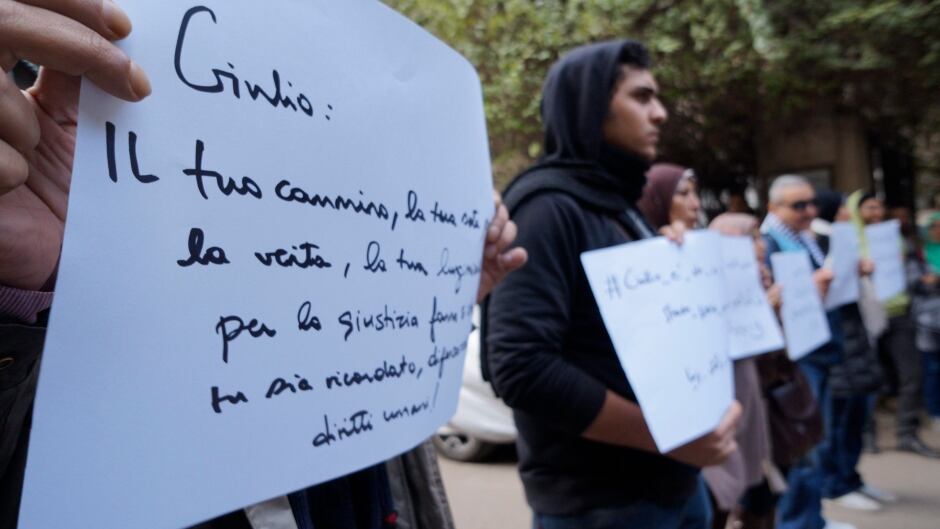 Mourners at a vigil for slain Italian graduate student Giulio Regeni, in front of the Italian embassy in Cairo, Egypt.