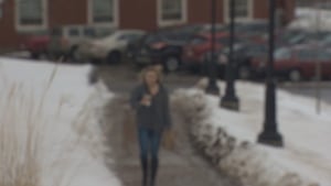 Blurred image of woman walking