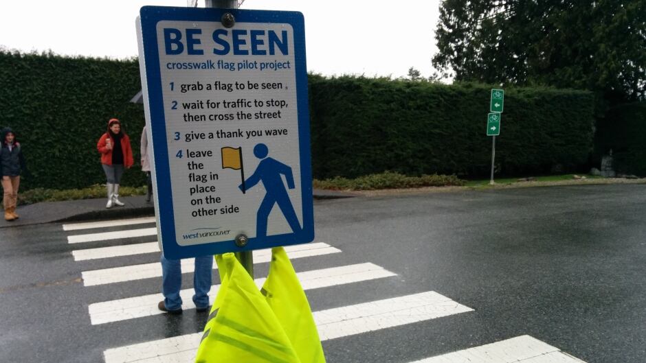 Anyone who cross at the intersection of Mathers Avenue and Thompson Crescent in West Vancouver can use these flags to remind drivers to slow down.