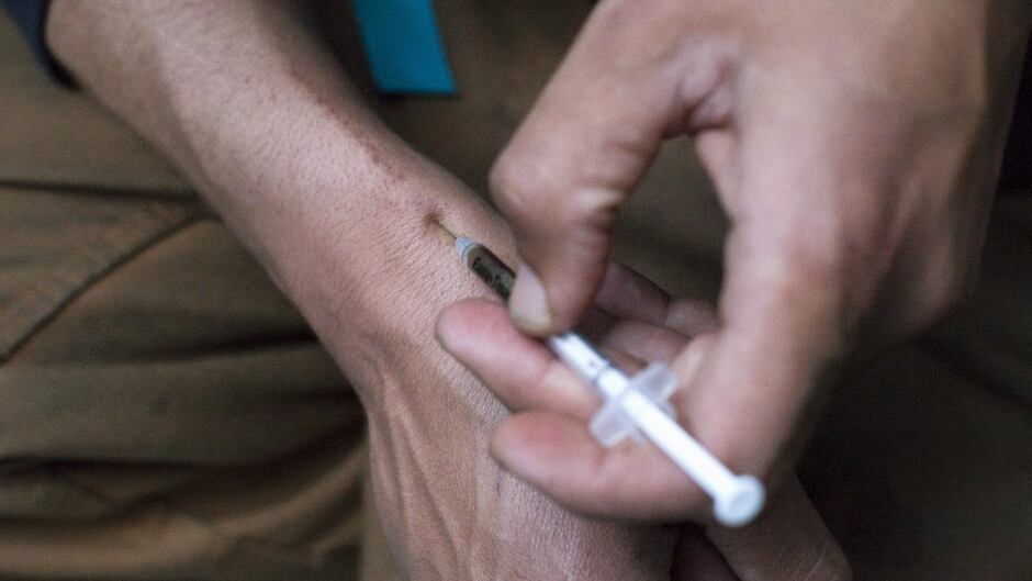 A man injects himself with heroin in this file photo.