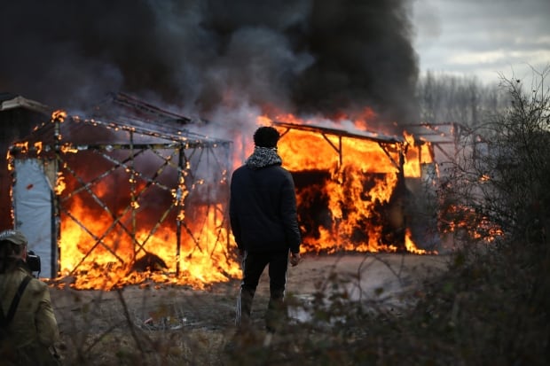 Calais Jungle refugee camp removed Feb 29 2016 89524804 flaming huts
