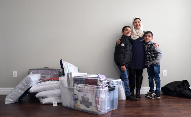 Mariela Barazi with family and donations