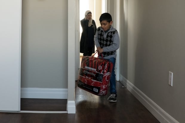 Mohammed Matar moves into his new apartment