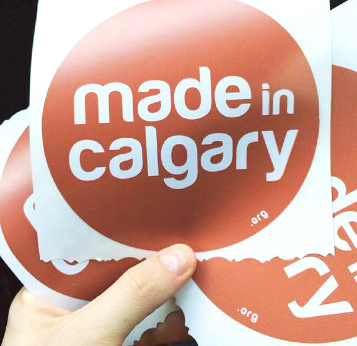 Made in Calgary red stickers point shoppers to local businesses during