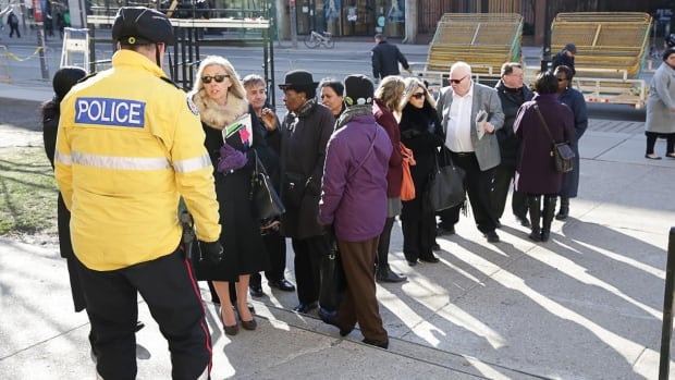 Mourners line up