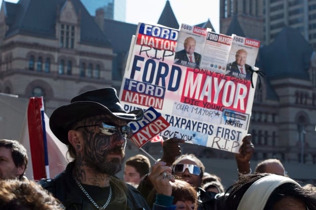 Ford mourners wait with RIP sign