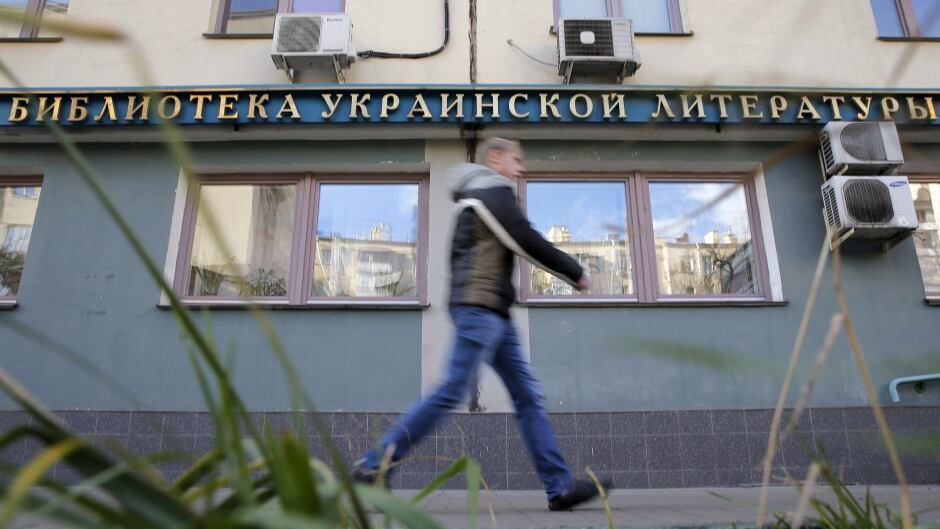 A man walks past the Library of Ukrainian Literature in Moscow, Russia. The library was raided in Oct. 2015 by Russia's security forces and the director of the library, Natalya Sharina, was accused of violating the law. Sharina has been held under house arrest since then.