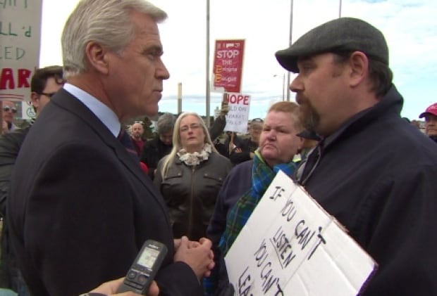 Dwight Ball faces protester CBC parking lot