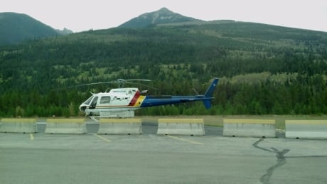 An RCMP helicopter lands near Valemount on the day John Buehler what shot and killed. RCMP Helicopter in Valemount