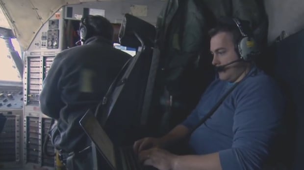 Richard Moore, NASA researcher, onboard Hercules C130