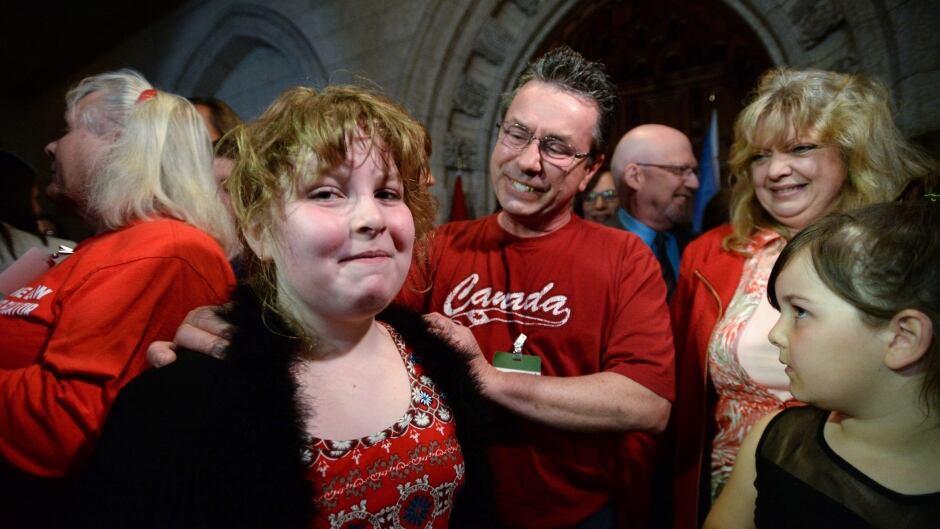 Charlie Lowthian-Rickert, 10, who is transgender, is comforted by her parents after speaking on Parliament Hill about legislation intended to protect her gender identity and gender expression.