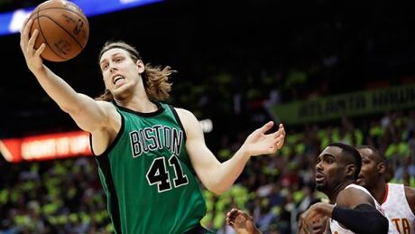 Boston Celtics forward Kelly Olynyk, left, pictured during a playoff game against the Atlanta Hawks in April, underwent shoulder surgery on Monday. His timetable for return has not been determined, raising questions about his availability for Canada this summer. olynyk-kelly-041616-620
