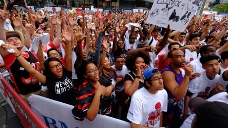 Sisters Dayne and Brittney McKenzie, third and fourth from left, watched Game 6 alongside thousands more Toronto Raptors fans. Toronto Raptors Game 6 Jurassic Park