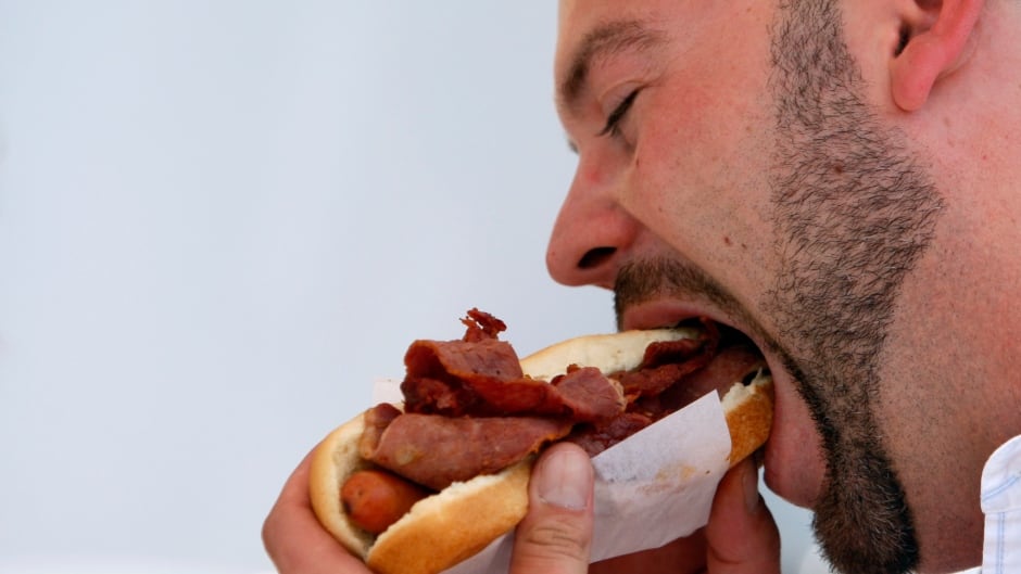 What would your reaction be if you heard this man chewing his hot dog?