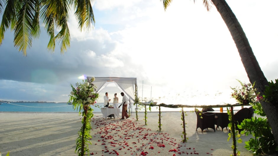 Is it worth escaping to a tropical location to get married, knowing that half of your guests won't make it?