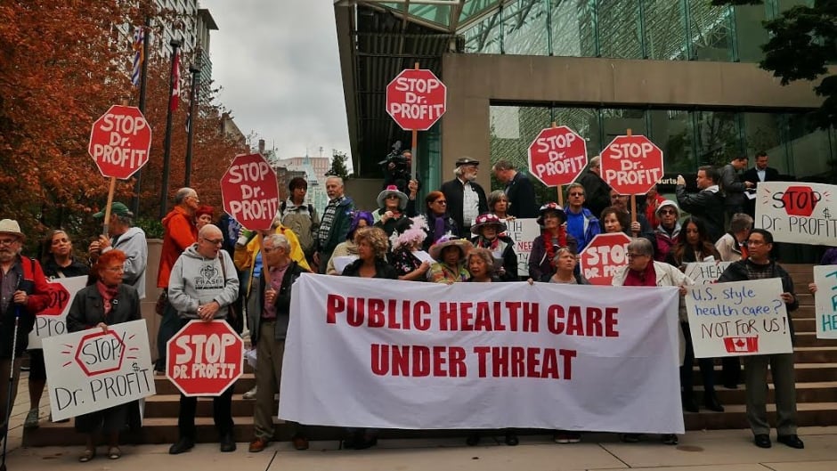 Demonstrators gather outside Vancouver courthouse to express their concerns over the Dr. Brian Day lawsuit against the B.C. government for banning the purchase of private insurance, Sept 6, 2016.