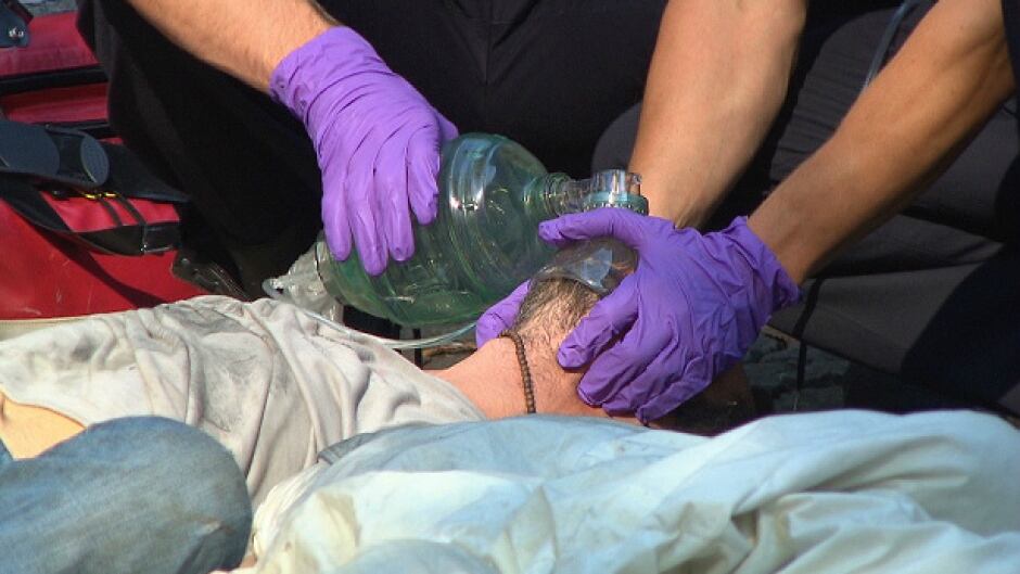 Vancouver paramedics work to revive an overdose victim.