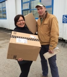 Joanna Awa and Paul Crowley outside the post office