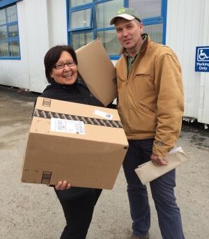 Joanna Awa and Paul Crowley outside the post office