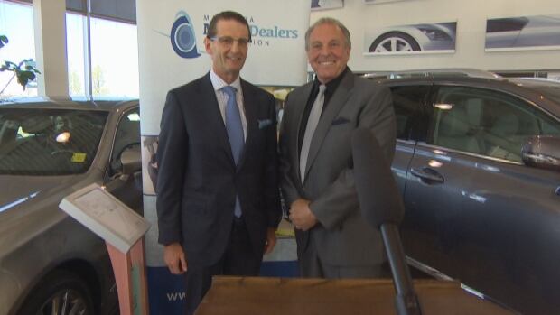 Birchwood Group president Steve Chipman and NDP Consumer Protection Minister Ron Lemieux at
